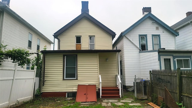164 Thompson St, Poughkeepsie, NY 12601 - rear view of property with fence and a chimney