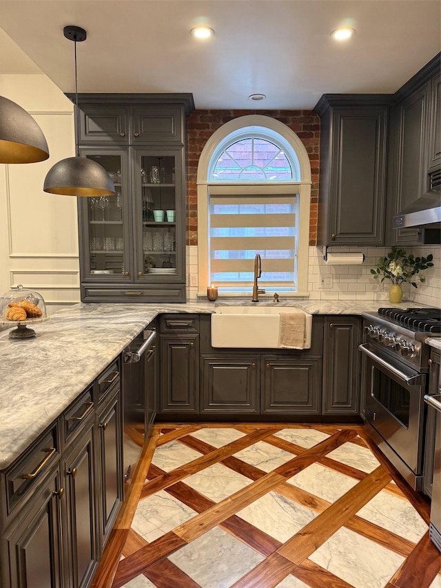 1821 Tenbroeck Ave, Bronx, NY 10461 - kitchen with a sink, high end stainless steel range oven, inlaid floor details, range hood, and decorative backsplash