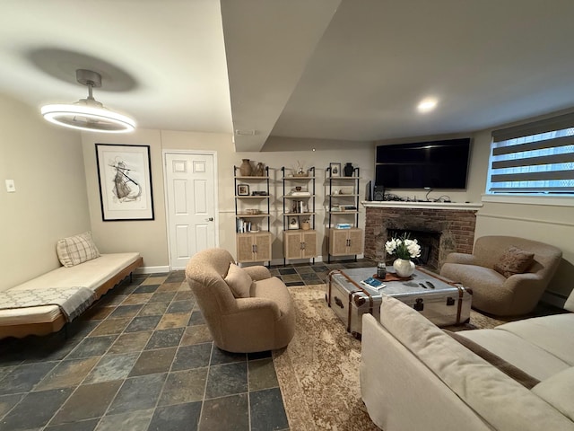 1821 Tenbroeck Ave, Bronx, NY 10461 - living area featuring stone tile flooring, a brick fireplace, and baseboards