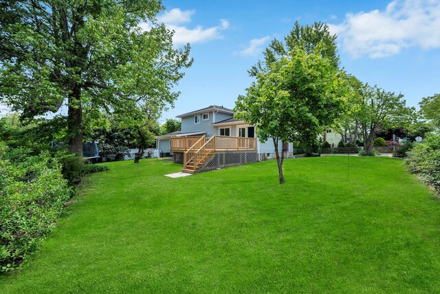 48 Hillside Ave, Patchogue, NY 11772 - view of grassy yard with a deck and stairway
