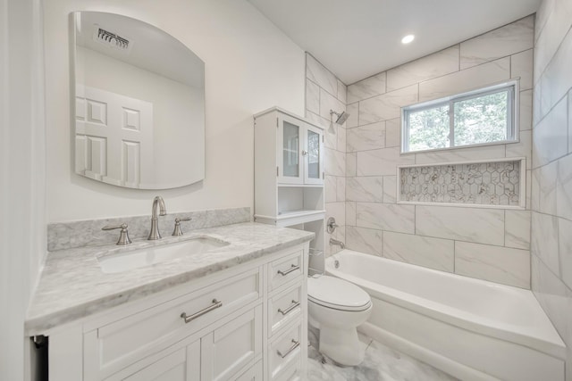 48 Hillside Ave, Patchogue, NY 11772 - bathroom featuring toilet, vanity, and tub / shower combination