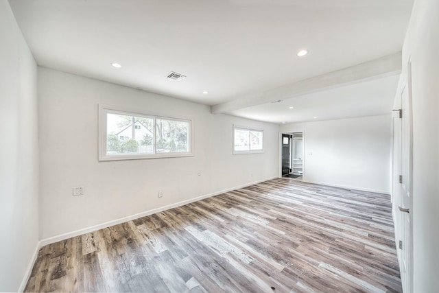 48 Hillside Ave, Patchogue, NY 11772 - unfurnished room featuring plenty of natural light, wood finished floors, recessed lighting, and baseboards