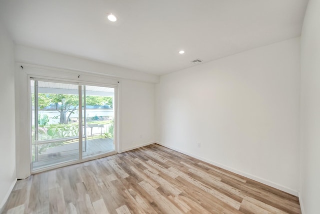 48 Hillside Ave, Patchogue, NY 11772 - unfurnished room with light wood-style floors, baseboards, and recessed lighting