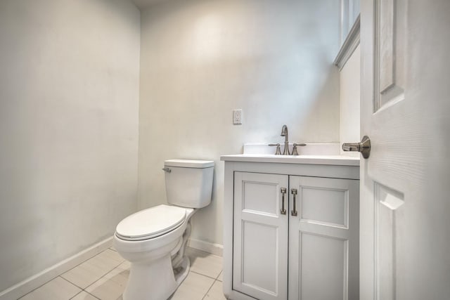 48 Hillside Ave, Patchogue, NY 11772 - half bathroom with baseboards, toilet, vanity, and tile patterned flooring