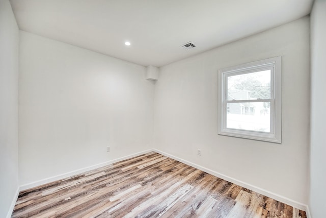 48 Hillside Ave, Patchogue, NY 11772 - spare room with wood finished floors, baseboards, and recessed lighting