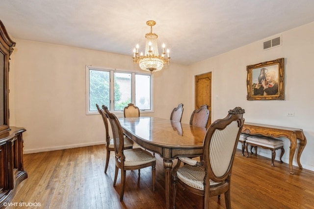 7 Ivy Ln, Lawrence, NY 11559 - dining space with a chandelier, light wood finished floors, and baseboards