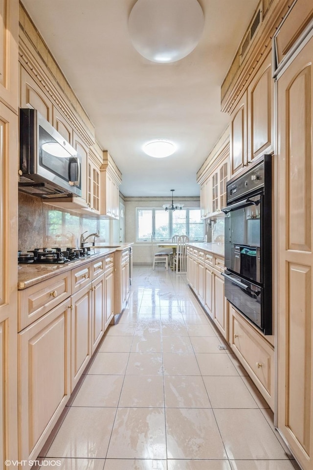 7 Ivy Ln, Lawrence, NY 11559 - kitchen with black appliances, a warming drawer, backsplash, light tile patterned floors, and glass insert cabinets
