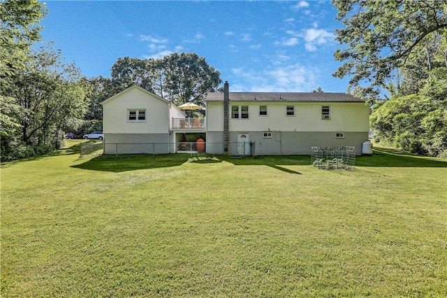 56 Church St, Wallkill, NY 12589 - back of property with a yard and a deck