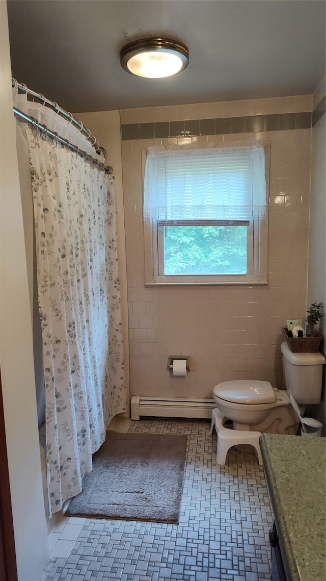 56 Church St, Wallkill, NY 12589 - full bath with a baseboard radiator, toilet, and curtained shower