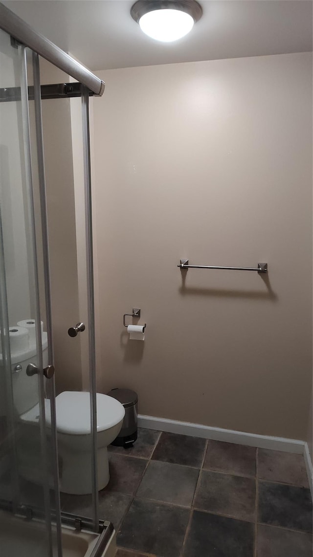 56 Church St, Wallkill, NY 12589 - bathroom with toilet, a shower stall, and baseboards