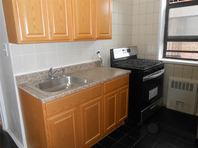 131-11KEWGARDENS Kew Gardens Rd Unit 4D, Richmond Hill, NY 11418 - kitchen with range with gas stovetop, radiator heating unit, a sink, dark tile patterned floors, and tile walls