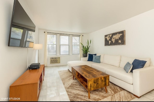 living room featuring healthy amount of natural light and a wall mounted AC