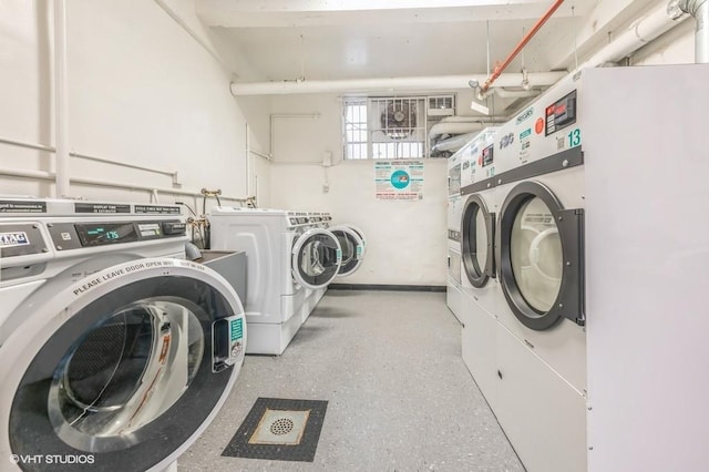 communal laundry room featuring independent washer and dryer