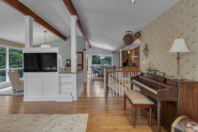 7 Tuxedo Dr, Melville, NY 11747 - hallway with wallpapered walls, light wood-type flooring, and decorative columns