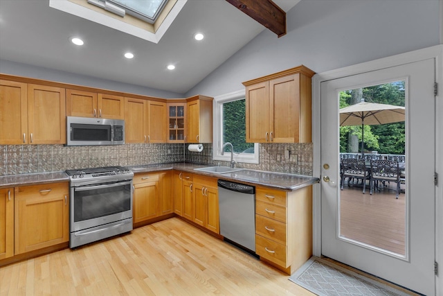 7 Tuxedo Dr, Melville, NY 11747 - kitchen with appliances with stainless steel finishes, a sink, a skylight, light wood-style flooring, and recessed lighting