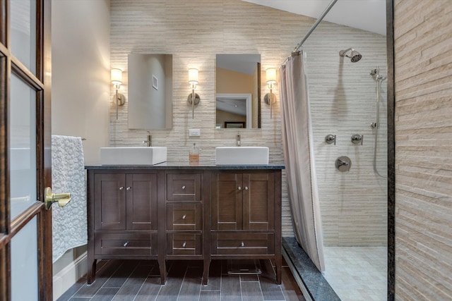 7 Tuxedo Dr, Melville, NY 11747 - full bathroom featuring a tile shower, double vanity, and baseboards