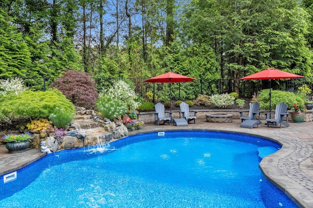 7 Tuxedo Dr, Melville, NY 11747 - view of swimming pool with an outdoor fire pit and a patio