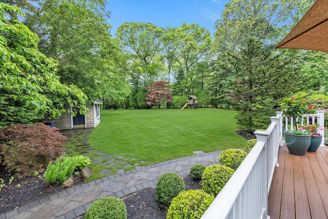 7 Tuxedo Dr, Melville, NY 11747 - view of green lawn with a playground and an outbuilding