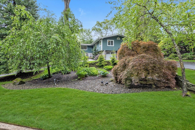 7 Tuxedo Dr, Melville, NY 11747 - view of green lawn with an attached garage