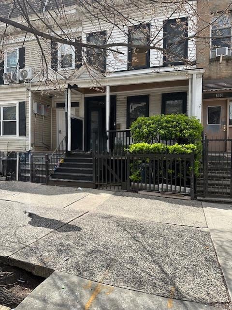 302 E 169th St, Bronx, NY 10456 - view of front of home with a porch, fence, and a gate