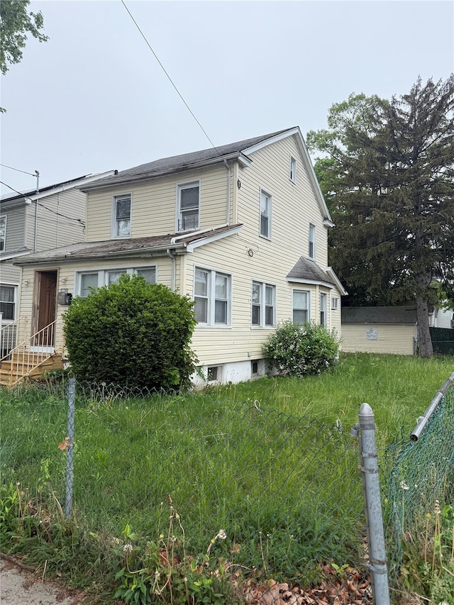114-02 208th St, Saint Albans, NY 11411 - view of home's exterior with fence