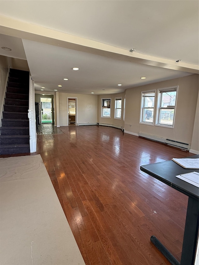 114-02 208th St, Saint Albans, NY 11411 - unfurnished living room with a baseboard radiator, stairs, wood finished floors, baseboards, and recessed lighting
