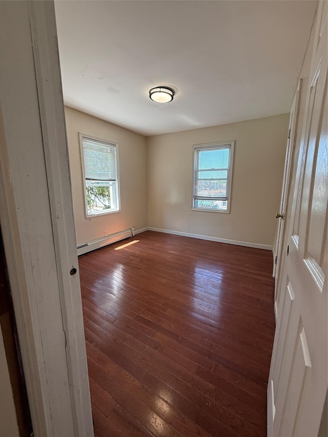 114-02 208th St, Saint Albans, NY 11411 - empty room with a baseboard radiator, plenty of natural light, dark wood-type flooring, and baseboards