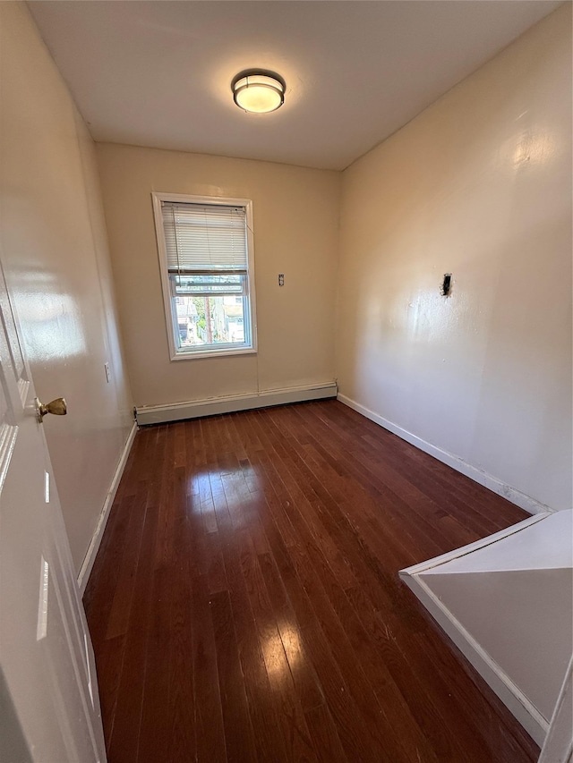 114-02 208th St, Saint Albans, NY 11411 - spare room featuring a baseboard heating unit, hardwood / wood-style flooring, and baseboards