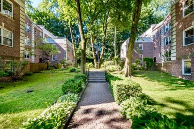 view of home's community with a lawn