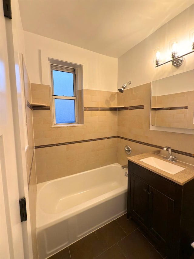 bathroom with tile patterned floors, shower / bath combination, and vanity