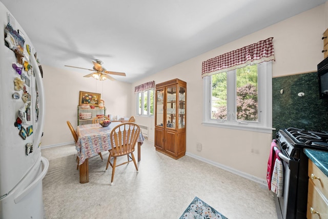 2816 215th Pl, Bayside, NY 11360 - dining area with ceiling fan and baseboards