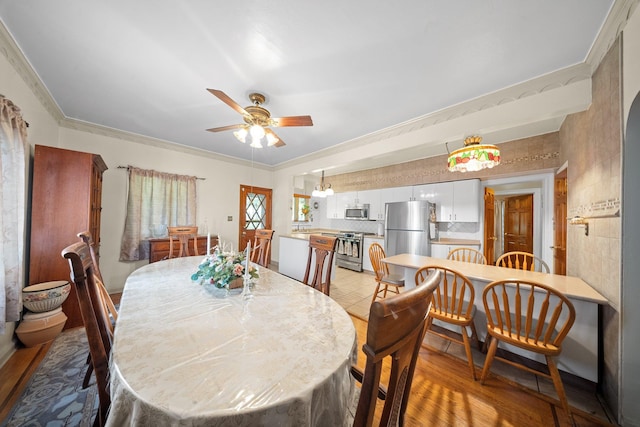 2816 215th Pl, Bayside, NY 11360 - dining area with a ceiling fan, light wood-style floors, and crown molding