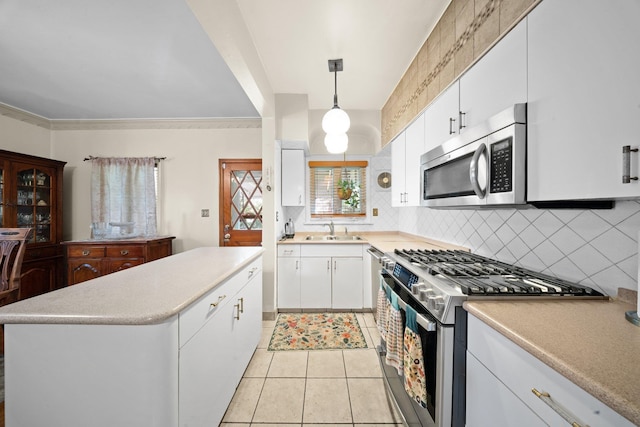 2816 215th Pl, Bayside, NY 11360 - kitchen with stainless steel appliances, a sink, tasteful backsplash, light tile patterned floors, and a kitchen island