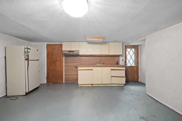 2816 215th Pl, Bayside, NY 11360 - kitchen featuring freestanding refrigerator, under cabinet range hood, cream cabinetry, and a sink