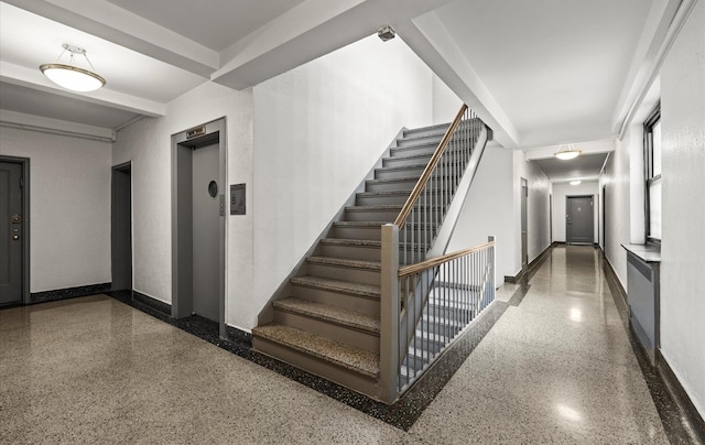 67-71 Yellowstone Blvd Unit 3-L, Forest Hills, NY 11375 - staircase featuring speckled floor, elevator, and baseboards