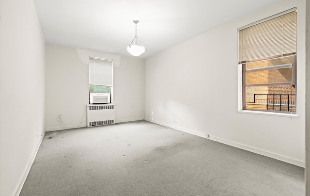 67-71 Yellowstone Blvd Unit 3-L, Forest Hills, NY 11375 - spare room featuring radiator, healthy amount of natural light, carpet floors, and baseboards