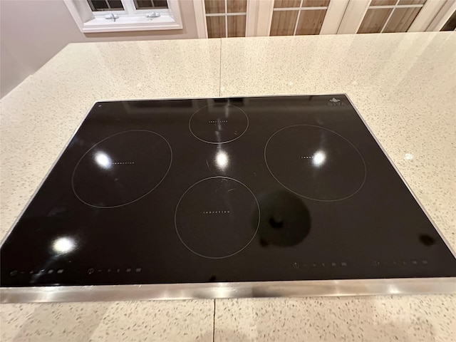 107 Norwood Ave, Northport, NY 11768 - kitchen view of black electric stovetop and light stone counters