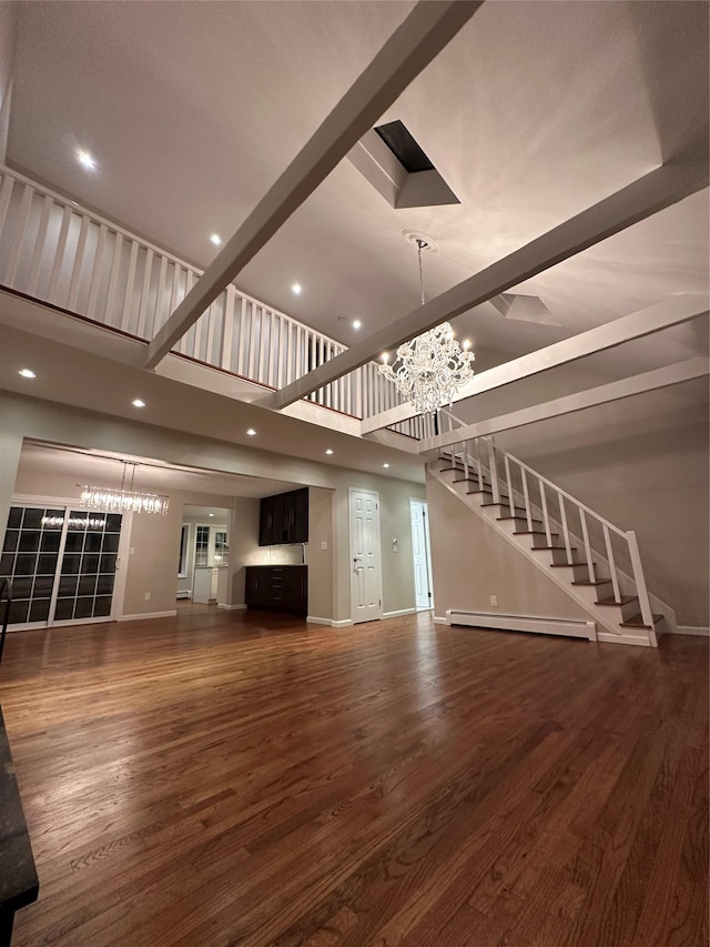 107 Norwood Ave, Northport, NY 11768 - unfurnished living room with a chandelier, stairway, dark wood finished floors, baseboards, and recessed lighting