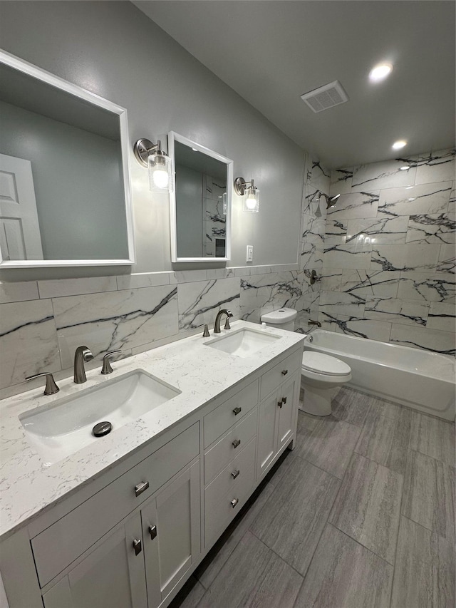 107 Norwood Ave, Northport, NY 11768 - bathroom with tile walls, toilet, double vanity, shower / tub combination, and recessed lighting