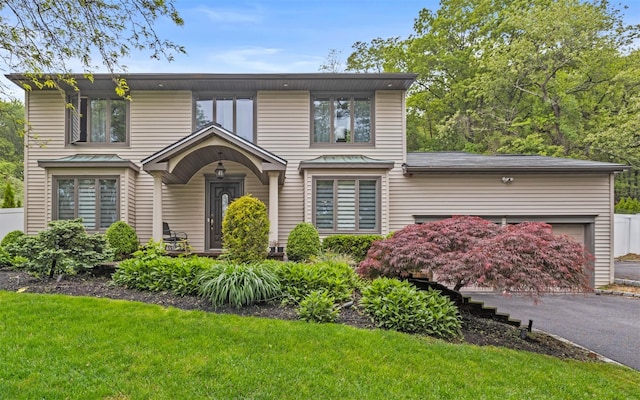 94 Stonehurst Ln, Dix Hills, NY 11746 - view of front of property featuring an attached garage and a front yard