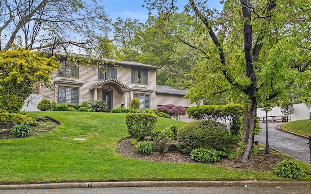 94 Stonehurst Ln, Dix Hills, NY 11746 - view of front of home featuring a front yard and driveway