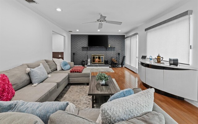 94 Stonehurst Ln, Dix Hills, NY 11746 - living room with ornamental molding, a fireplace, wood finished floors, ceiling fan, and recessed lighting