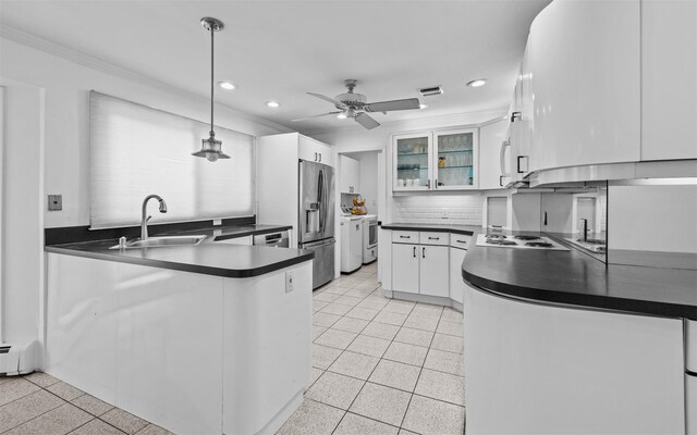 94 Stonehurst Ln, Dix Hills, NY 11746 - kitchen with stainless steel fridge with ice dispenser, a sink, a peninsula, dark countertops, and recessed lighting