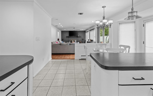 94 Stonehurst Ln, Dix Hills, NY 11746 - kitchen with dark countertops, recessed lighting, ceiling fan, pendant lighting, and baseboards