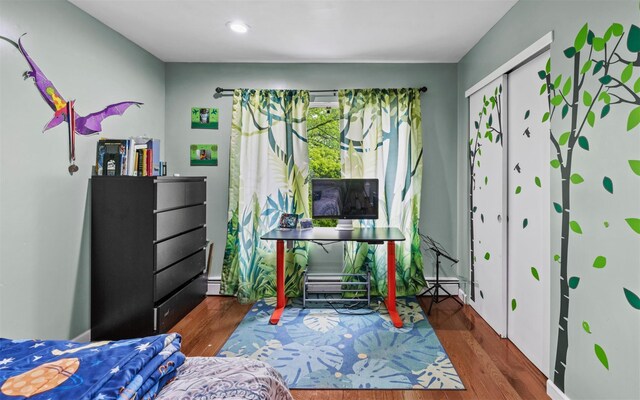 94 Stonehurst Ln, Dix Hills, NY 11746 - bedroom featuring wood finished floors, baseboard heating, and recessed lighting