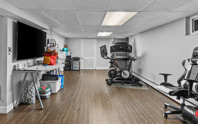 94 Stonehurst Ln, Dix Hills, NY 11746 - exercise room featuring wood finished floors, a drop ceiling, and baseboards