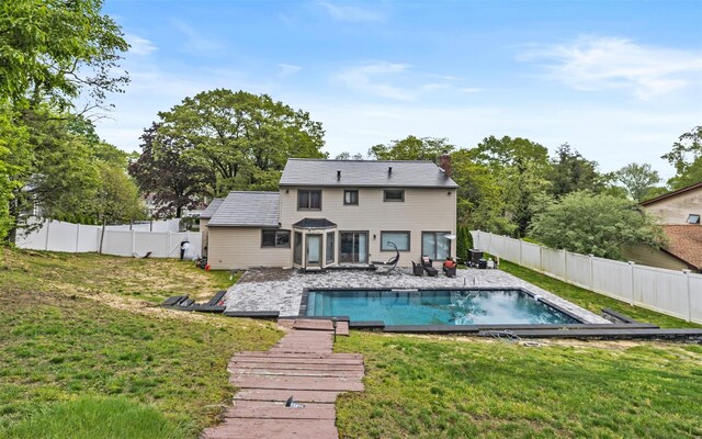 94 Stonehurst Ln, Dix Hills, NY 11746 - rear view of house with a chimney and a patio