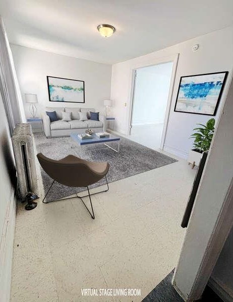 1898 Longfellow Ave Unit E4, Bronx, NY 10460 - living room with radiator heating unit