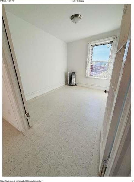 1898 Longfellow Ave Unit E4, Bronx, NY 10460 - unfurnished room featuring radiator and baseboards