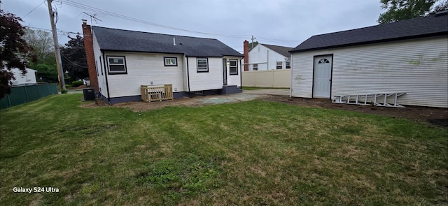 151 Boylston St, Hempstead, NY 11550 - back of house with central AC, a chimney, and a patio